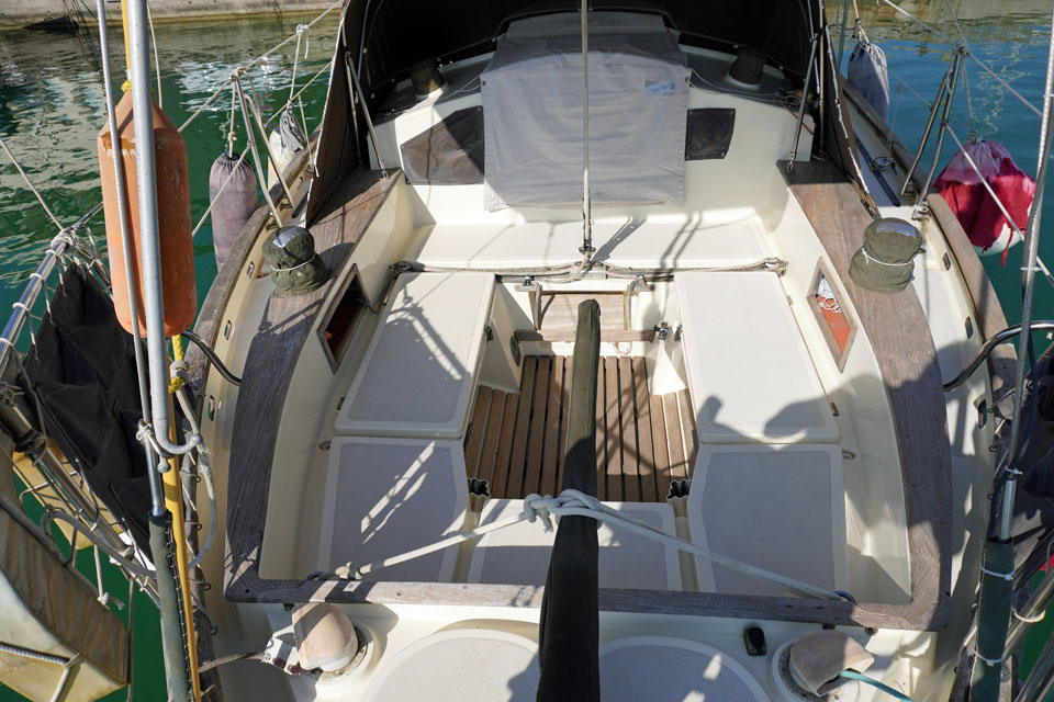 The cockpit of a canoe-sterned sailboat