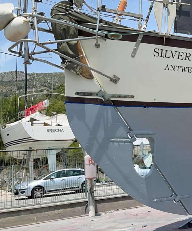 Transom-hung rudder on a long-keeled canoe-sterned sailboat