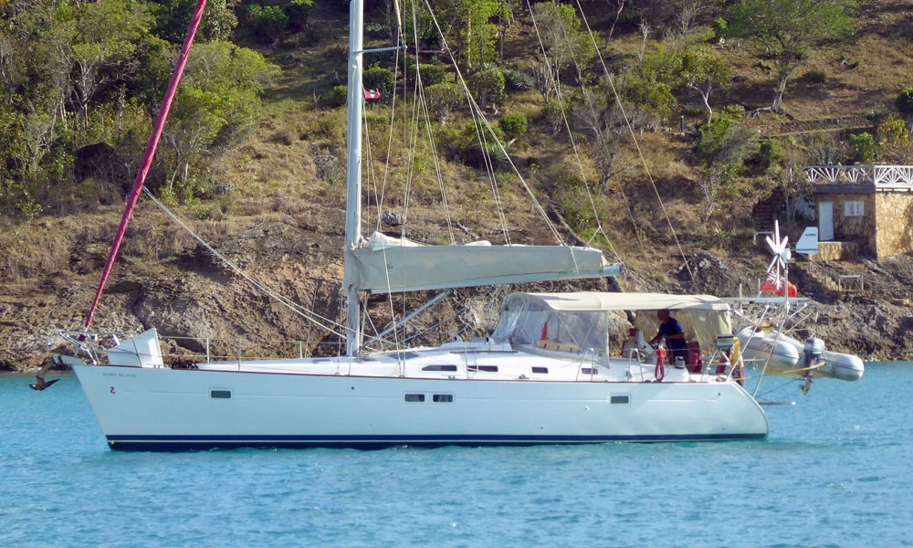 A Beneteau 423 sailboat at anchor in Deep Bay, Antigua