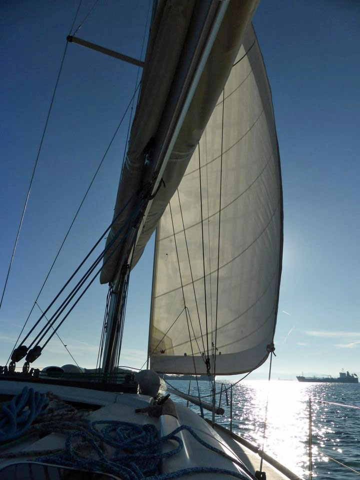 The foresail and mainsail of a Beneteau Oceanis Family 46 sailboat