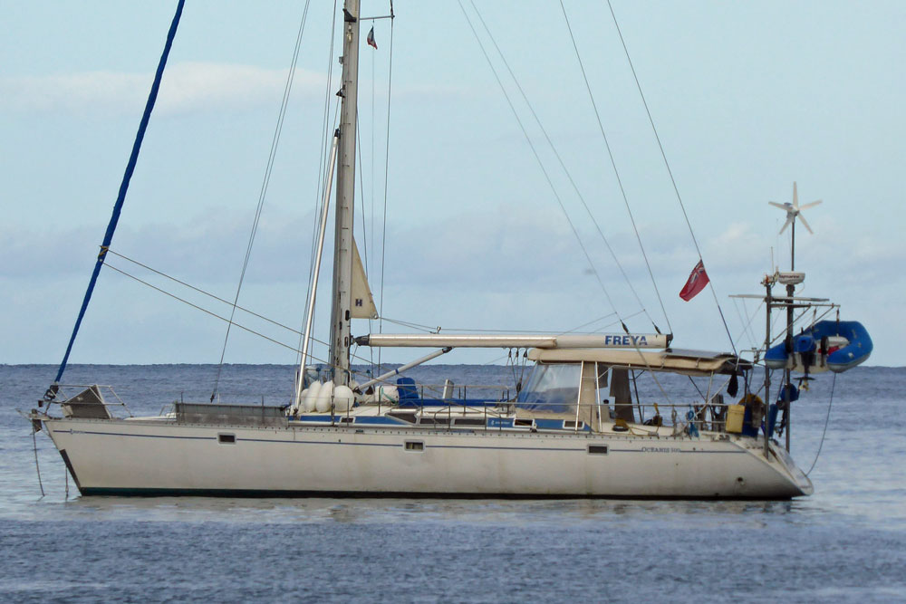 A Beneteau Oceanis 500 sailboat at anchor