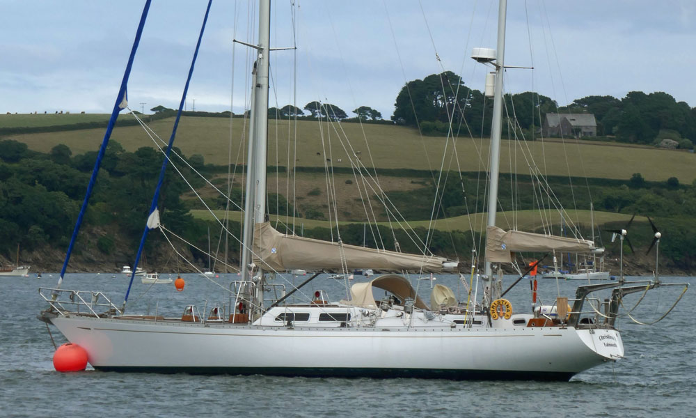 A Bowman 57 staysail ketch moored on the Helford River in Cornwall, UK.