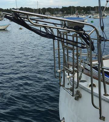 Stainless steel davits and boarding ladder on sailboat transom