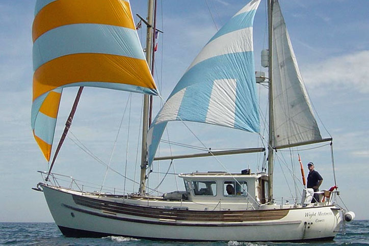 A Fisher 34 motorsailer flying a mizzen staysail