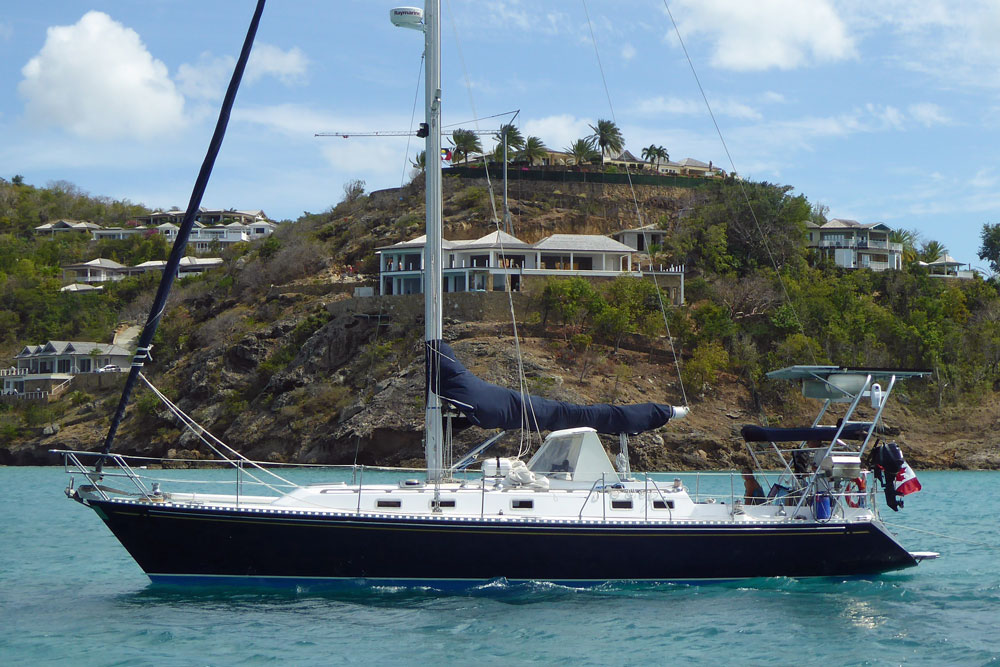 'Exit Stage Left', a Hylas 42 cruising yacht approaches the anchorage in Deep Bay, Antigua, West Indies.
