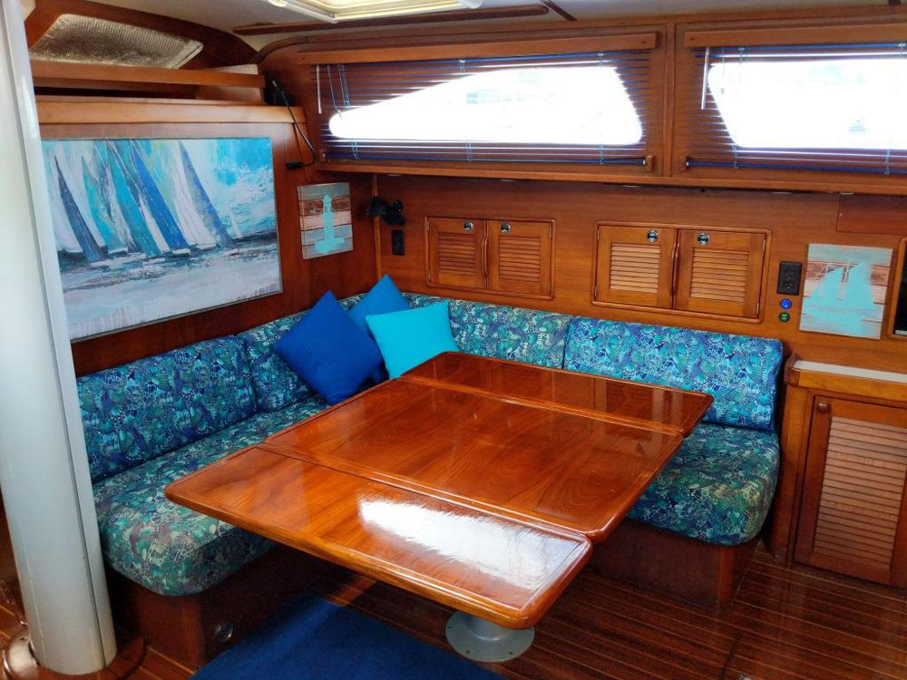 The dining table in the main saloon of an Irwin 54 cruising sailboat