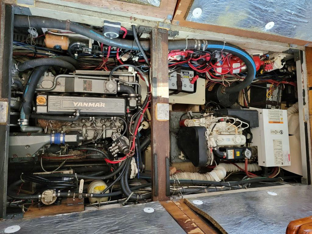 The main engine and generator compartment on an Irwin 42 sailboat