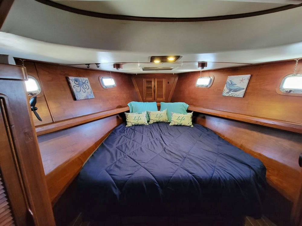 The V-berth in the forecabin of an Irwin 54 sailboat