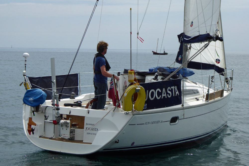 A Jeanneau Sun Odyssey 26 Sailboat waiting for a breeze to fill its sails