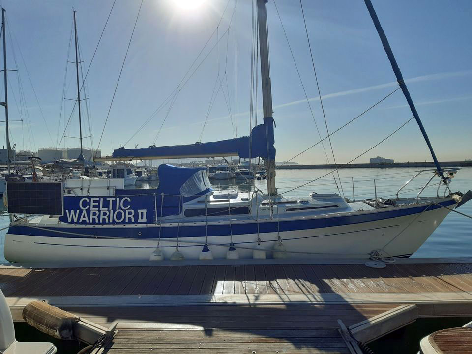 'Celtic Warrior II', a Moody 33 sailboat berthed alongside.