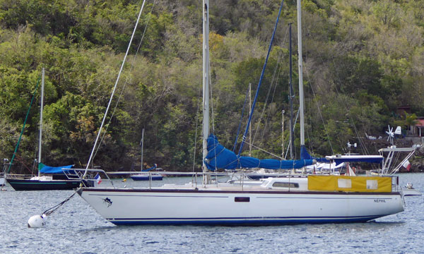 A Jouet 1300 sailboat moored in Anse D'Arlet, Martinique, West Indies