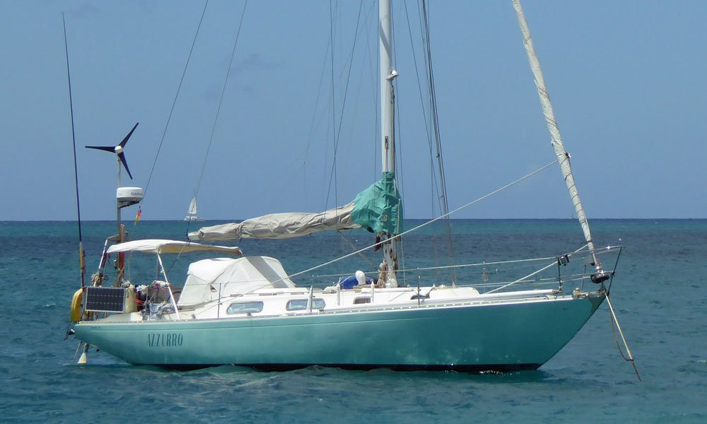 The Ohlson 38 sailboat 'Azzurro' at anchor off St Anne, Martinique in the French West Indies