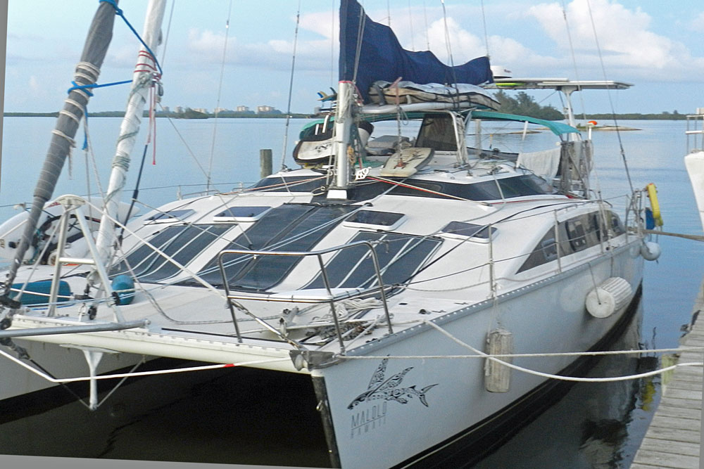 'Malolo', a PDQ 38 catamaran alongside a dock
