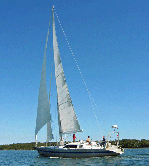A Passoa 47 cutter rigged aluminium cruising boat under full sail