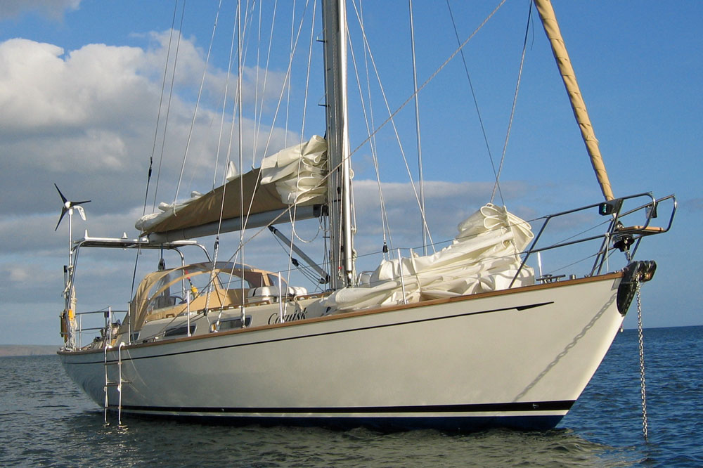 Designed by Stephen Jones, this cutter rigged Rustler 42 sailboat is designed and equipped for ocean cruising.