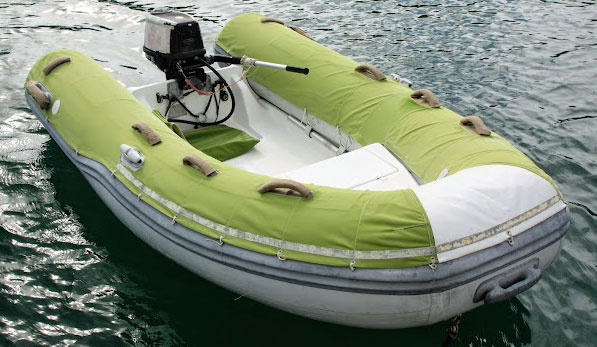 A typical 4-person tender and outboard motor for the crew