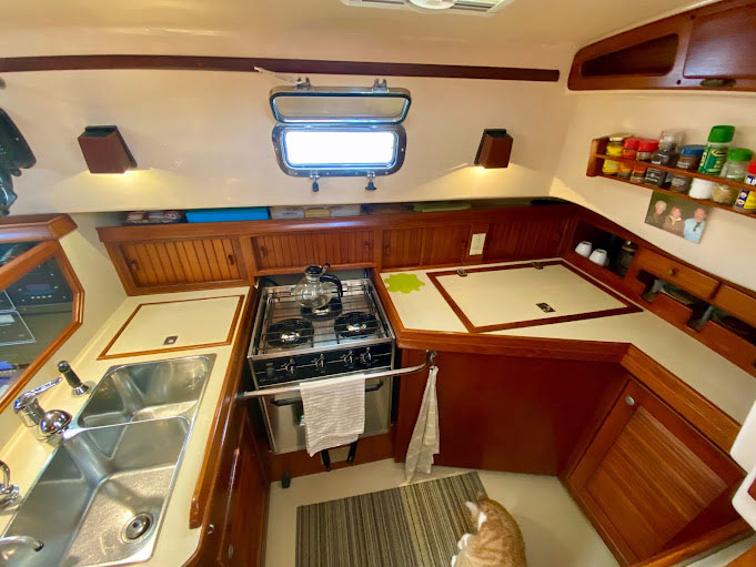 Galley with double sink unit, 4-burner stove, fridge and freezer on 40 ft sailboat