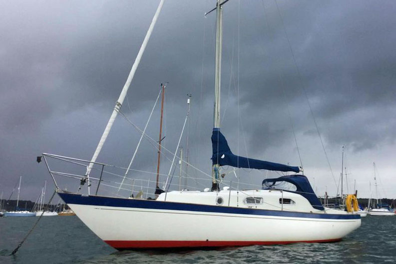 A SHE 31 sailboat at anchor