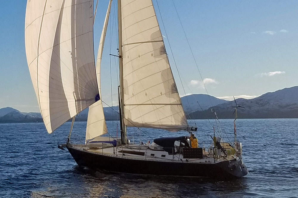 'Stormalong', a Van de Stadt Caribbean 40 sailboat under full sail