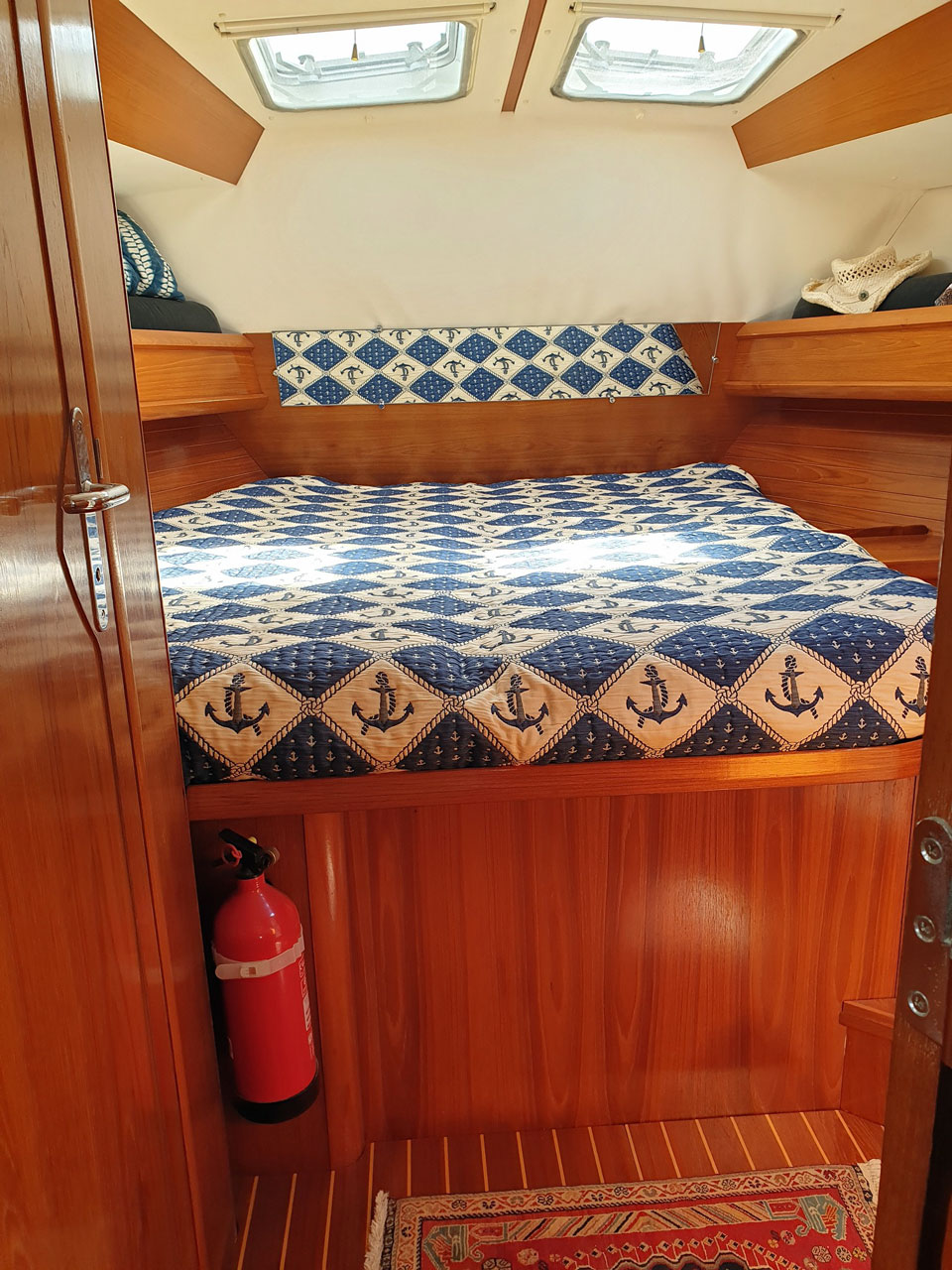 The double berth in the forepeak on a Jeanneau Sun Odyssey 45-1 sailboat