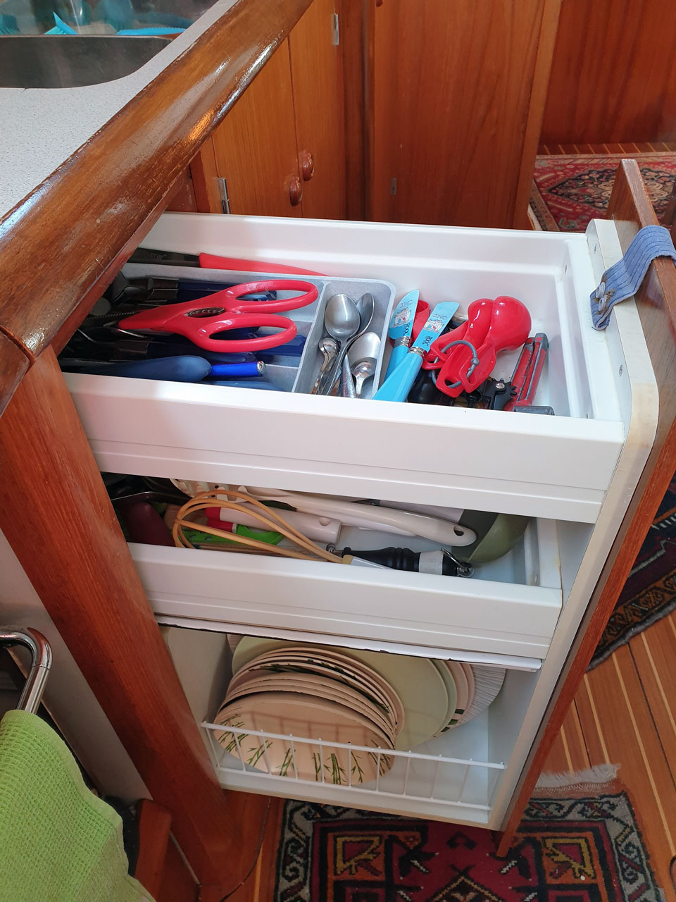 The cutlery drawer on a Jeanneau Sun Odyssey 45-1 sailboat