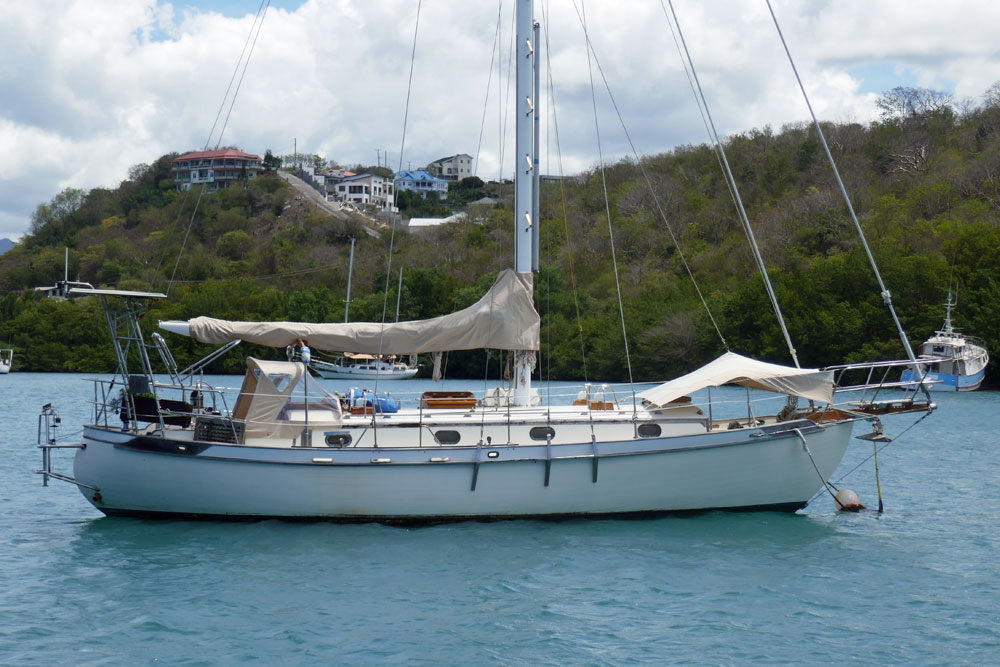 A Tayana 37 sailboat on a mooring ball in Prickly Bay, Grenada, West Indies.