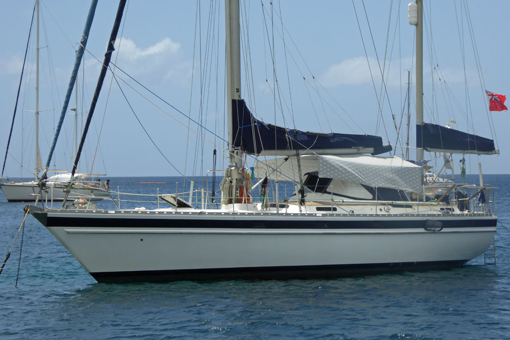 'Wild Bird', a Trintella 44 ketch sailboat at anchor.