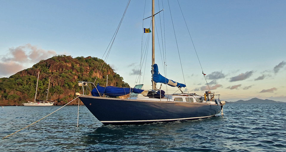 A Van de Stadt 30 sailboat at anchor in the West Indies