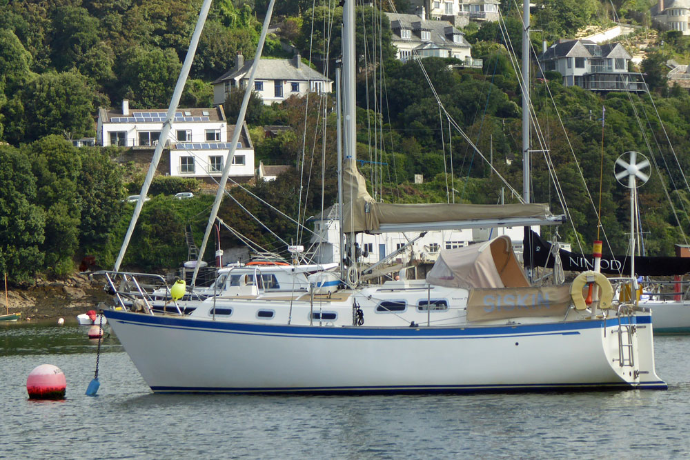 A Vancouver 27 cutter on a mooring ball