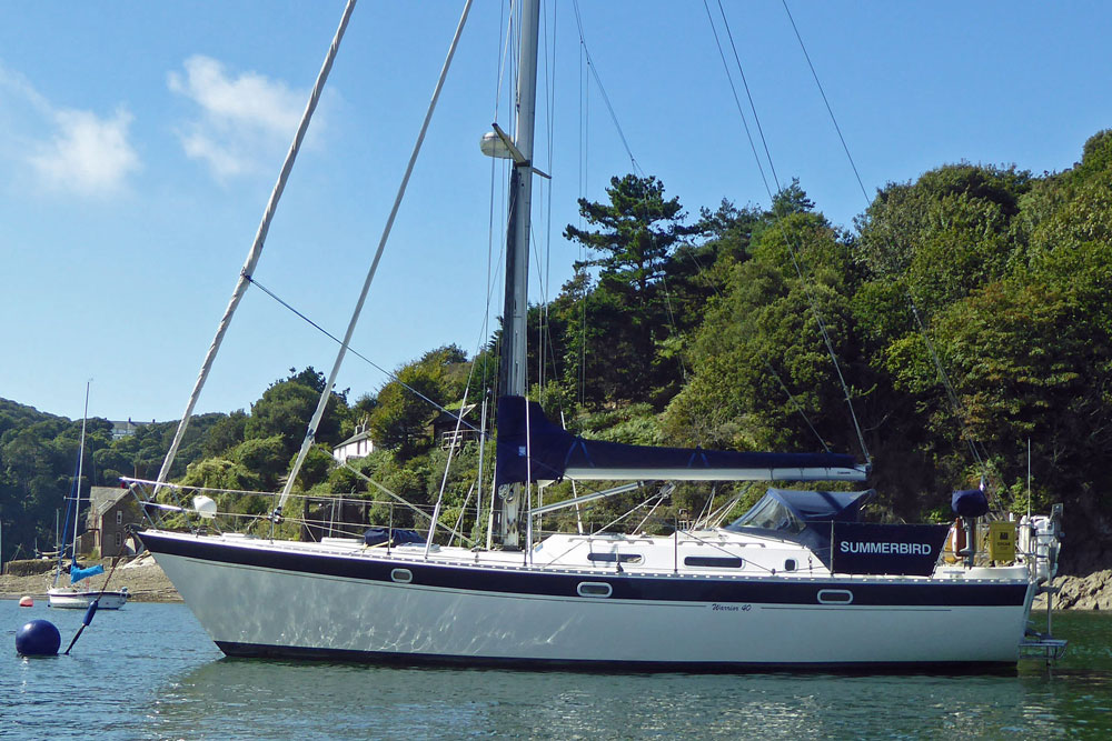 'Summerbird' a Warrior 40 sailboat on a mooring ball in the River Yealm, near Plymouth, UK