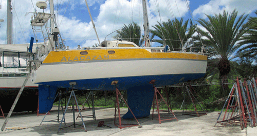 Sailboat supported ashore on tripod stands