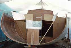 grp cockpit moulding being fitted to sailboat