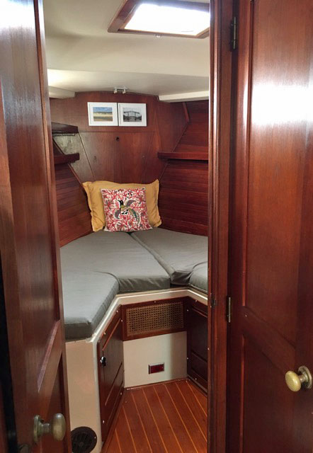 The V-berth in the forepeak of a Morgan 41 Classic sailboat