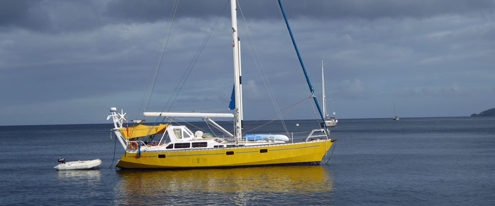 Yellow sailboat at anchor