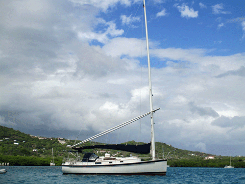 A wishbone-rigged Nonsuch 30 cruising yacht
