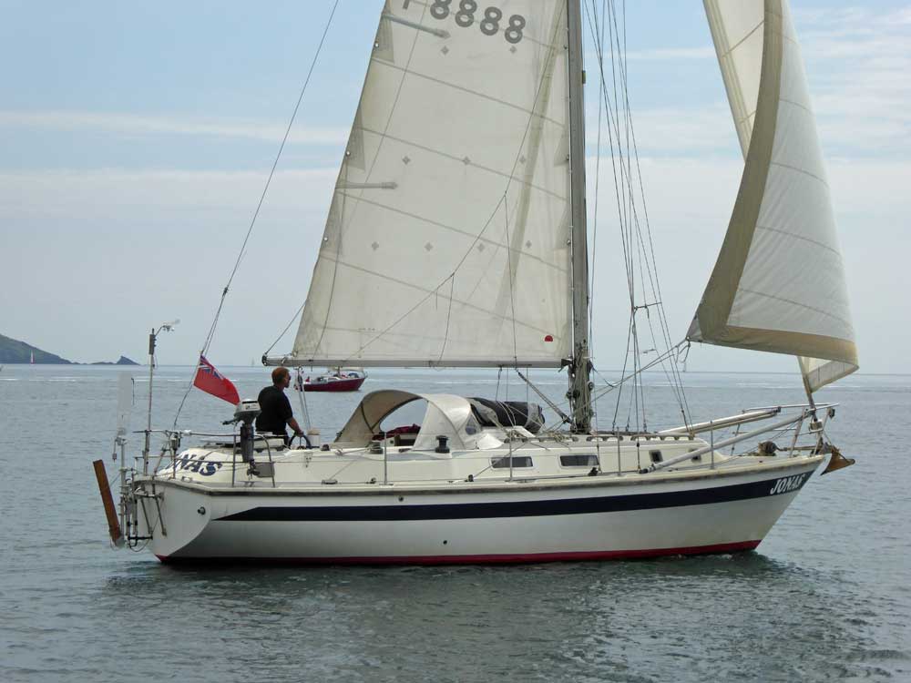 A Bilge-Keeled Westerly 33 Sloop sailing in Plymouth Sound, UK
