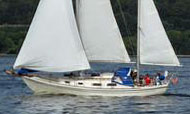 An Allied Seawind ketch under full sail