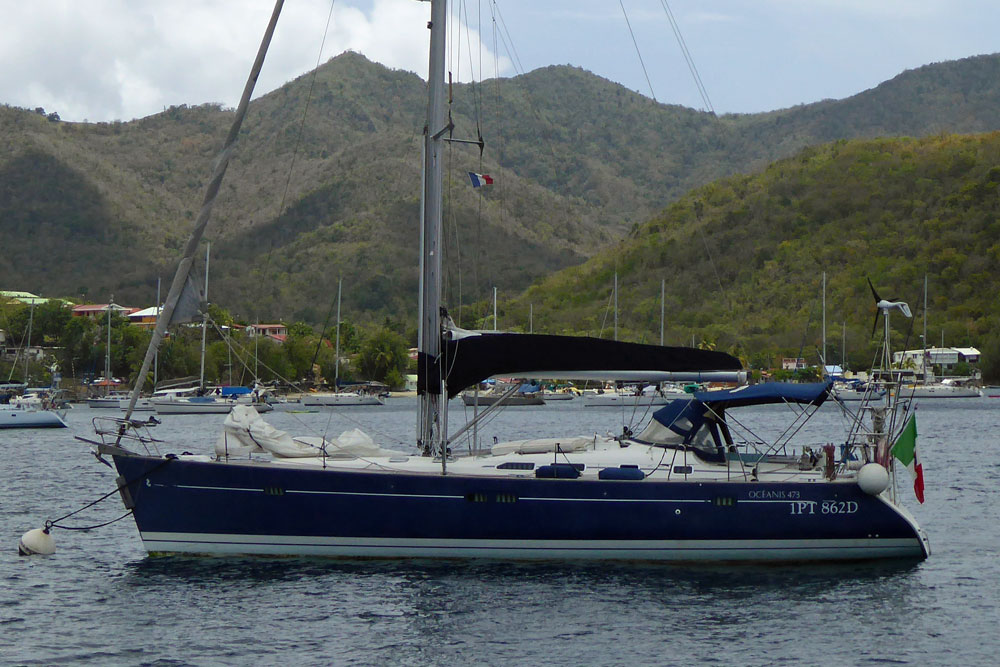 A Beneteau Oceanis 473 sailboat on a mooring ball