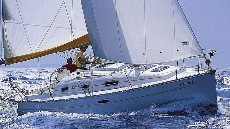 A Beneteau Oceanis Clipper 311 making good progress under full sail
