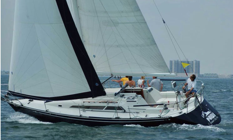 'Cats Paws', a C&C 34+ cruising yacht beating to windward under full sail