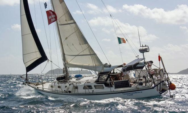 A Cascade 36 sloop beating to windward under shortened sail.