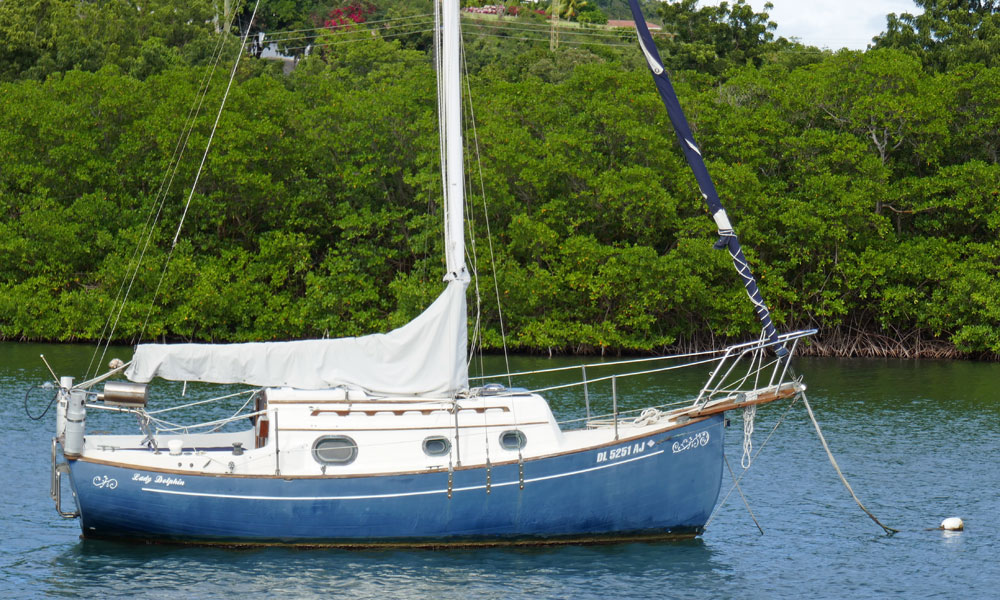 A Flicka 20 sailboat on a mooring in English Harbour, Antigua.