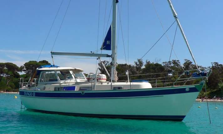 A Hallberg-Rassy 94 sailboat at anchor