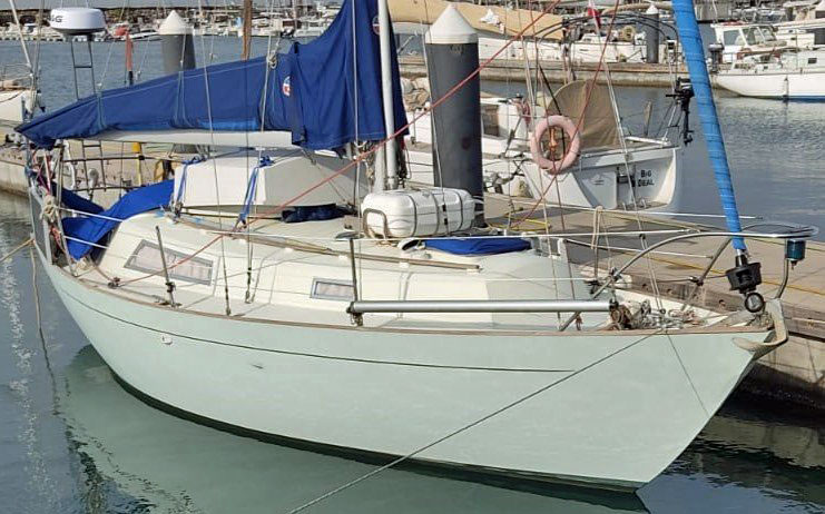 Halmatic 30 sailboat alongside dock