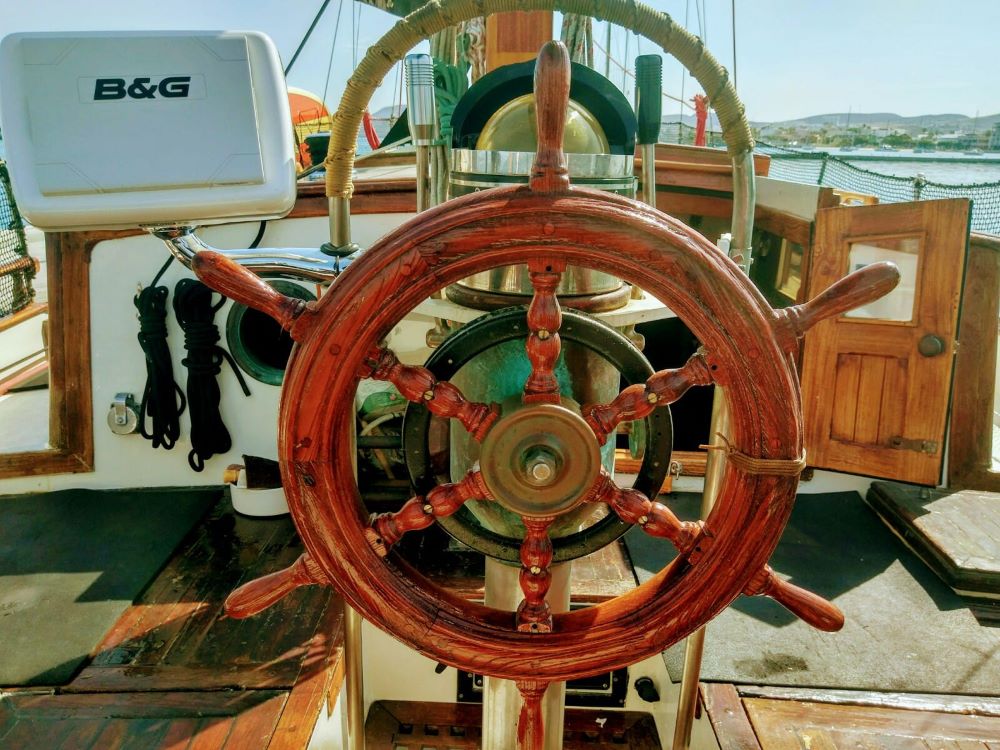Classic wooden wheel on this Hardin Seawolf cruising sailboat