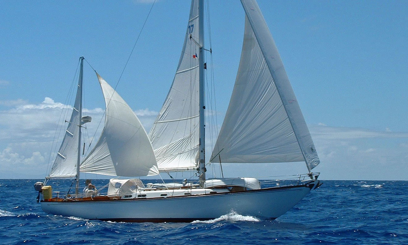 A Hinckley Sou'wester 42 yawl-rigged sailboat with mizzen staysail set.