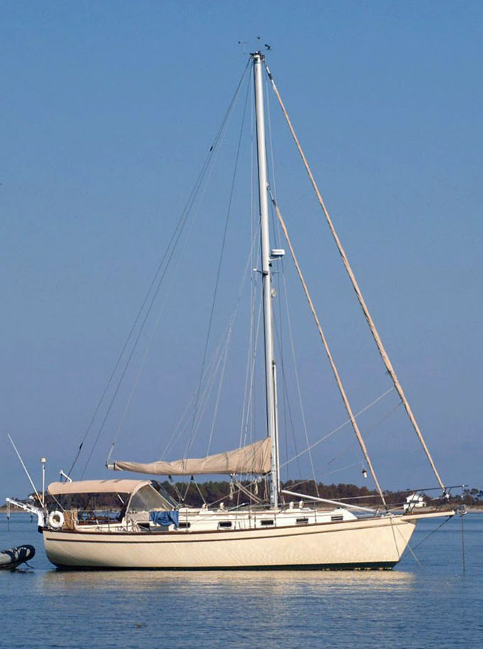 An IP38 sailboat at anchor
