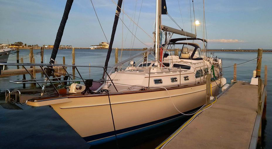 An IP465 sailboat on a dock