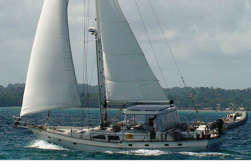 An Irwin 54 cutter sailing under headsail and full mainsail.