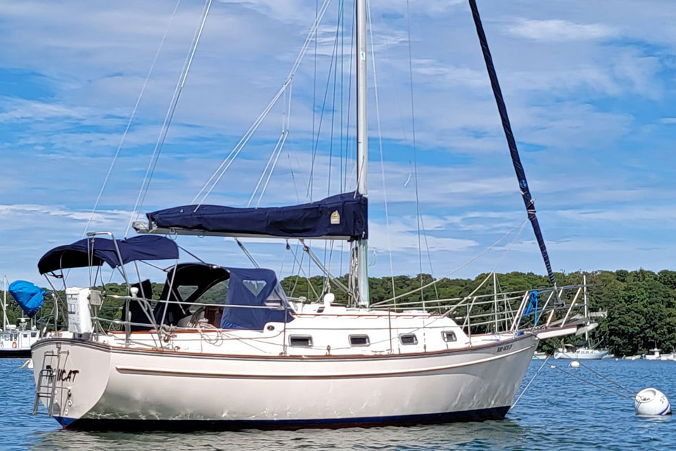 An Island Packet 29 sailboat on a mooring ball